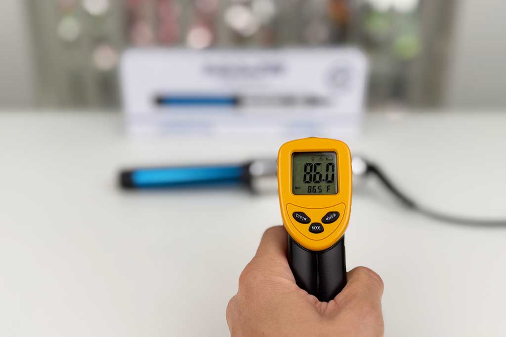Infrared thermometer showing 86°F handle surface temperature.