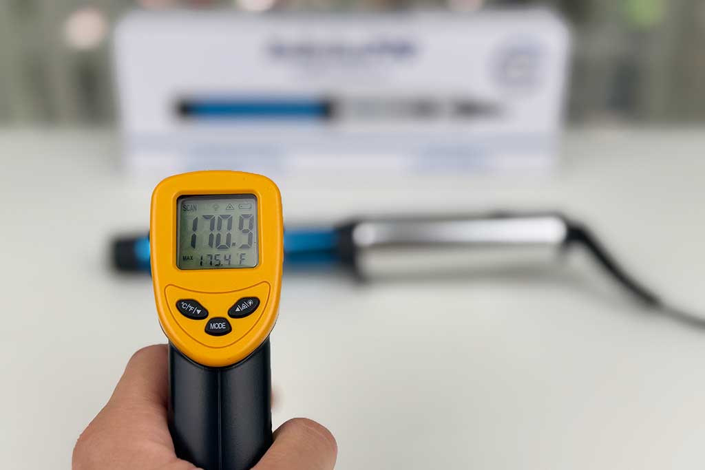Infrared thermometer reading 170°F on the BaBylissPRO Compact Curling Wand barrel.