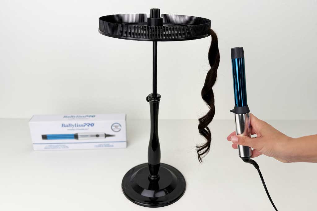 Wrapping wig hair around the Compact Wand’s 1″ barrel — creates defined curls but only in small sections due to shorter barrel. ©BeautiLAB