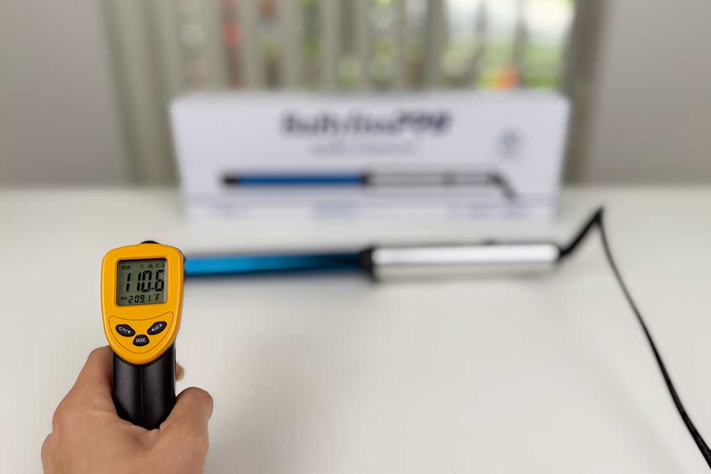Infrared thermometer reading 110°F at the cool tip of the BaBylissPRO Curling Wand.