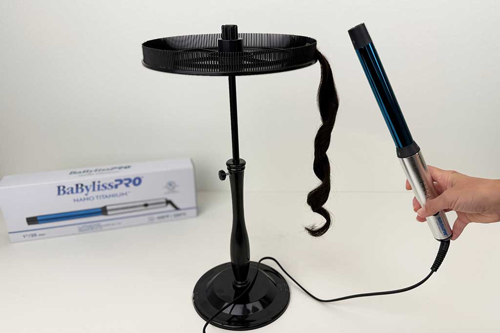 Close-up of defined curls created on a wig with the BaBylissPRO Curling Wand.