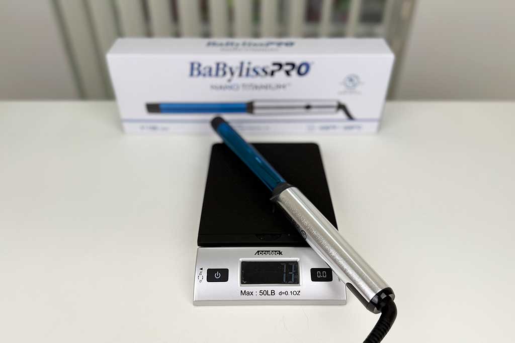 Digital scale reading 7.3 ounces with the BaBylissPRO Nano Titanium Curling Wand on top.