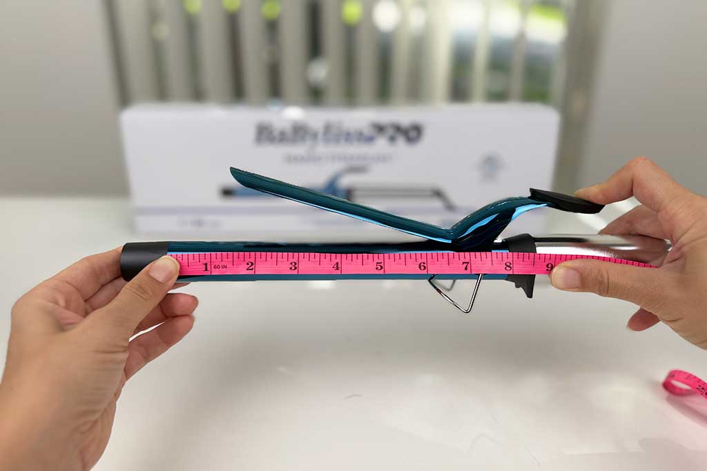 Digital caliper measuring the 7-inch titanium barrel of the BaBylissPRO Nano Titanium Extended Barrel Curling Iron.