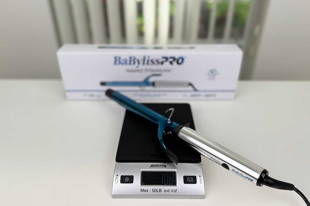 Digital scale showing 10.3 ounces with the BaBylissPRO Nano Titanium Extended Barrel Curling Iron placed on top.