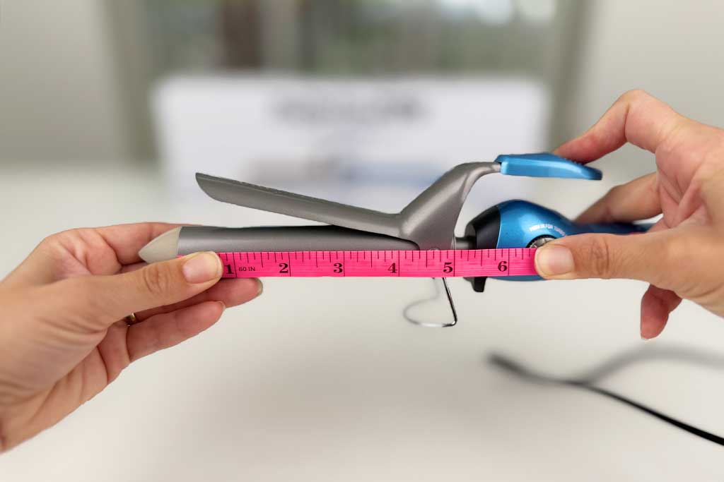 Caliper measuring the 4″ barrel length of the BaBylissPRO Nano Titanium Spring Curling Iron.