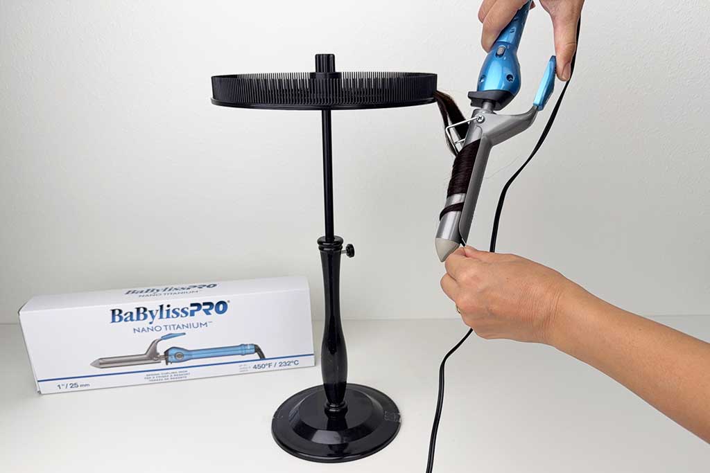 Wig hair section wrapped around the BaBylissPRO Nano Titanium Spring Curling Iron barrel.