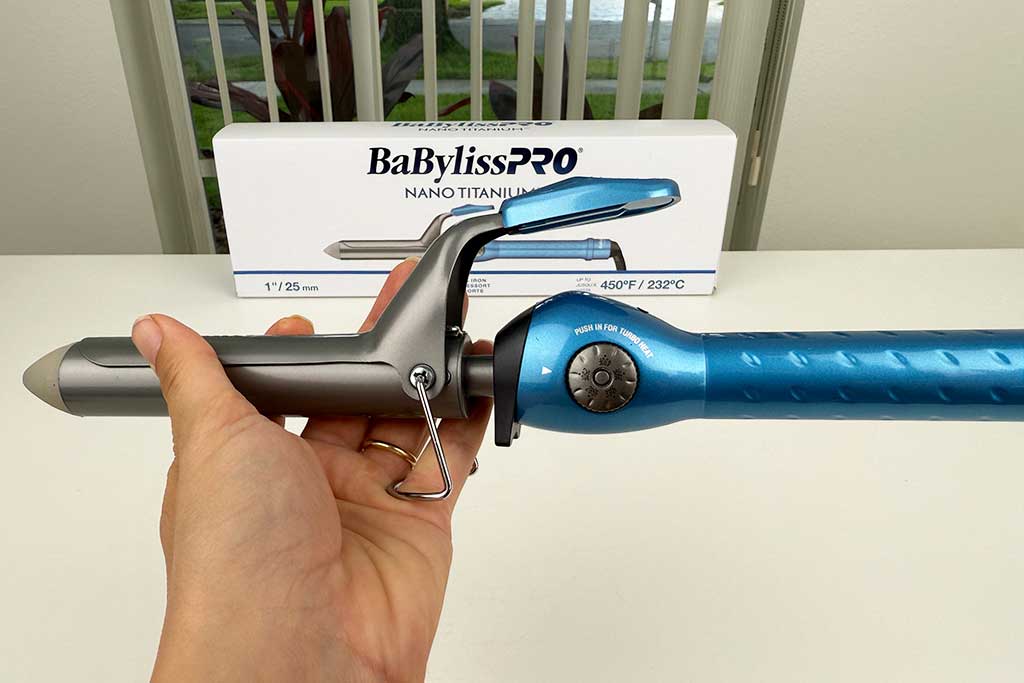 Close-up of the BaBylissPRO Nano Titanium Spring Curling Iron’s manual heat wheel dial with 50 numbered settings.