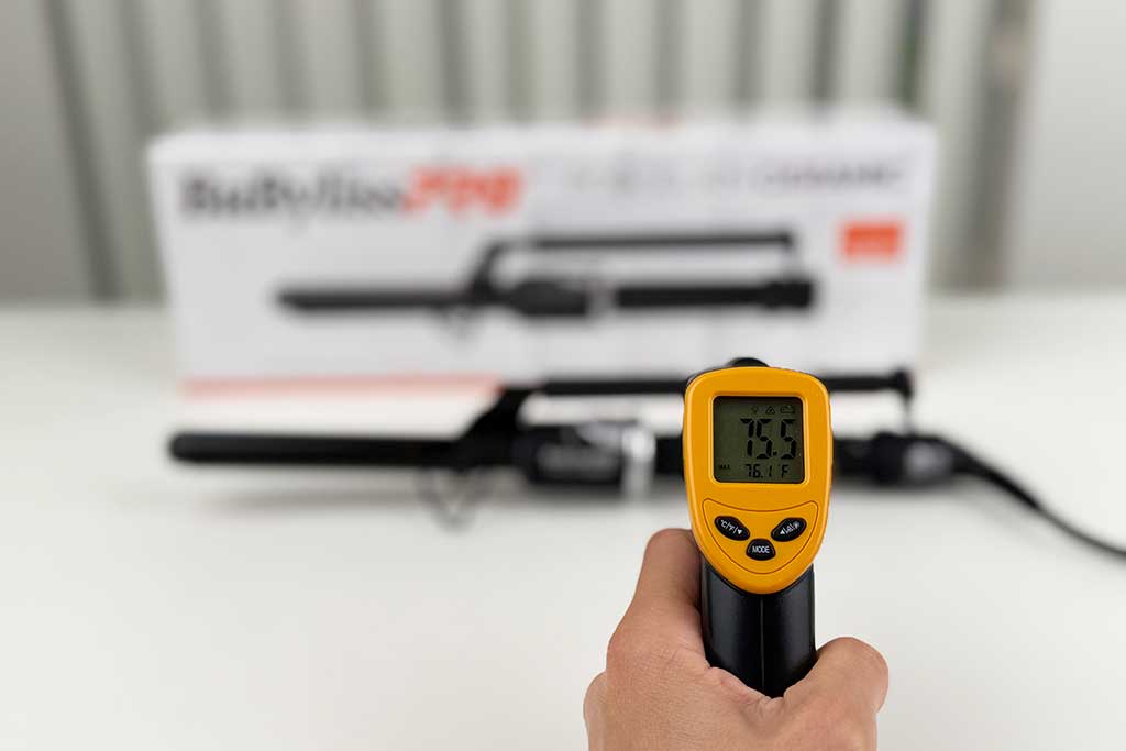 Infrared thermometer measuring 75°F on the Marcel wand stick of the BaBylissPRO iron.