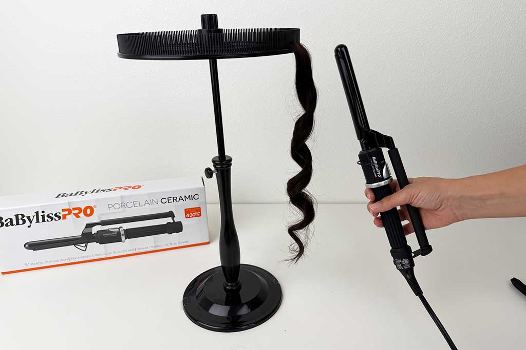 Close-up of defined curls made on wig hair with the BaBylissPRO Marcel Curling Iron.