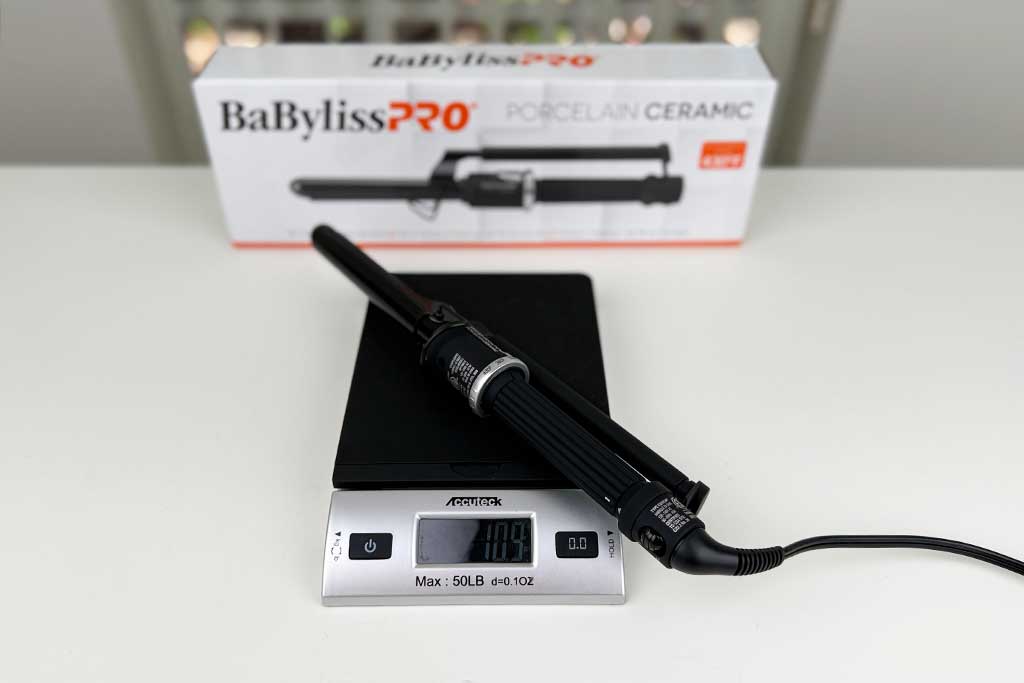 Digital scale showing 10.9 ounces with the BaBylissPRO Porcelain Ceramic Marcel Curling Iron on top.