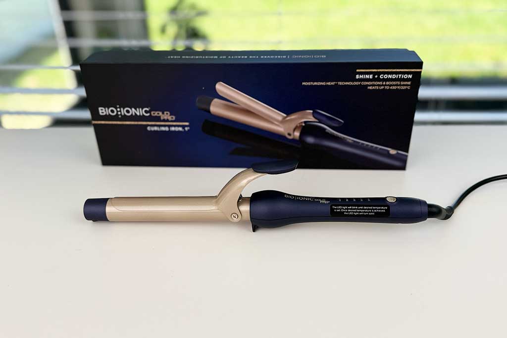 Bio Ionic GoldPro Curling Iron review photo with 24K gold ceramic spring clamp design.