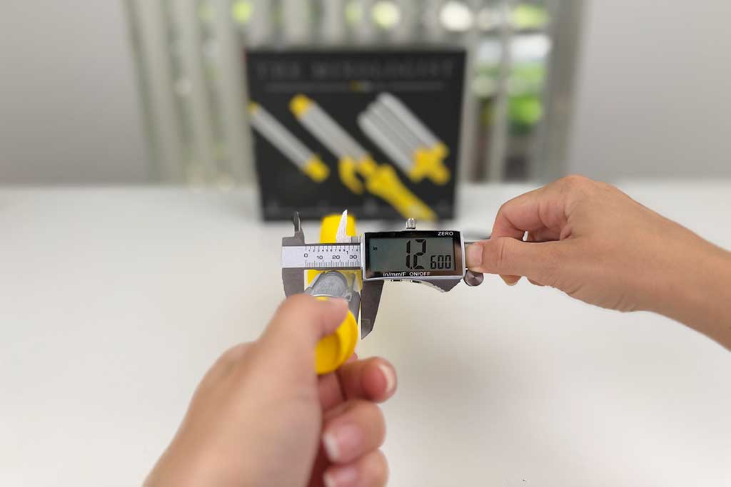 Drybar Mixologist 1.25-inch spring curling iron attachment with built-in clamp for precise curls.