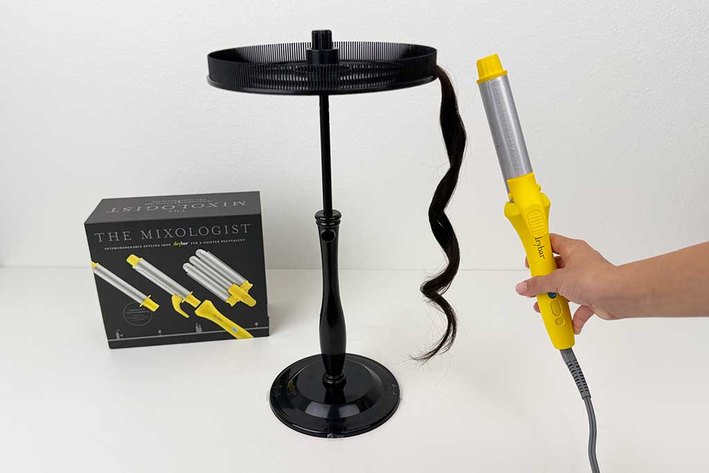 Tight, uniform curls on wig hair created with the Mixologist spring curling iron attachment.