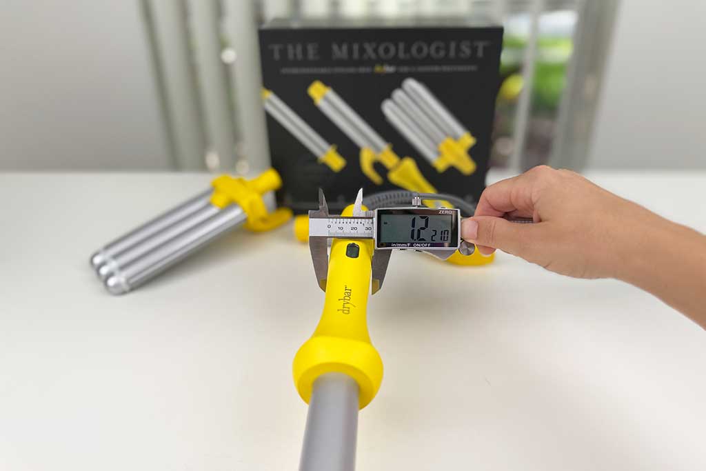 Digital caliper showing 1.2 inches on the Drybar Mixologist handle.