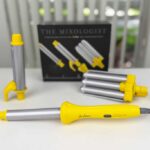 Drybar Mixologist Styling Iron on lab bench, showing base and three barrels (wand, spring iron, triple barrel).