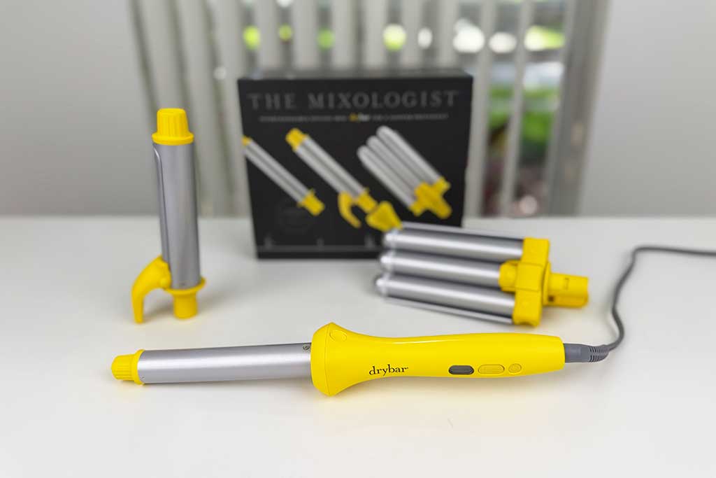 Drybar Mixologist Styling Iron on lab bench, showing base and three barrels (wand, spring iron, triple barrel).