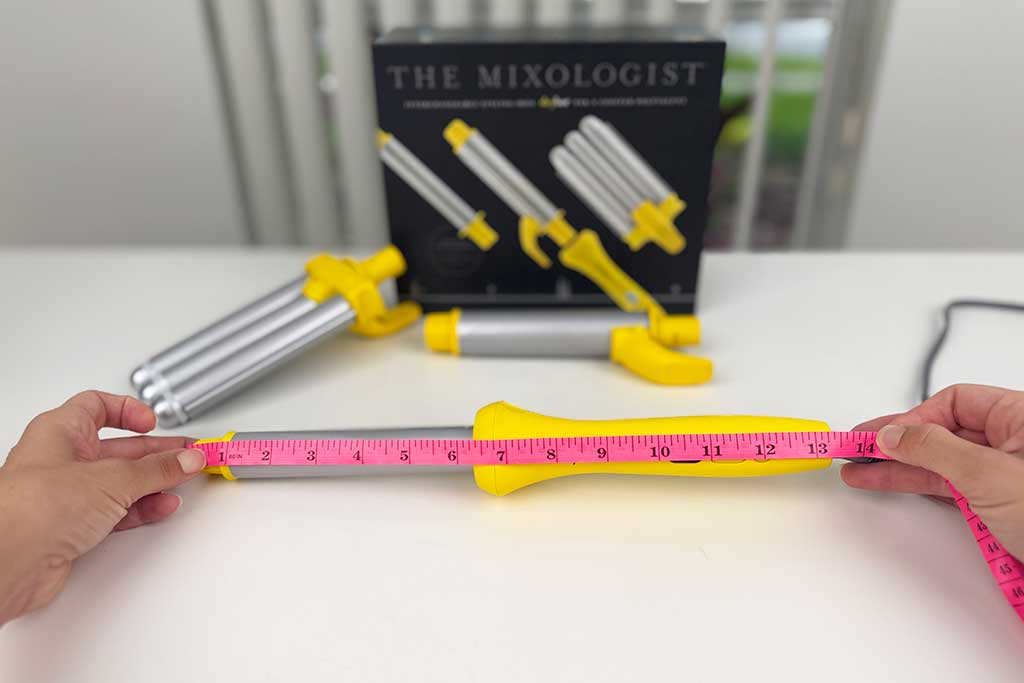 Measuring tape showing 13.5 inches along the Drybar Mixologist wand attachment.
