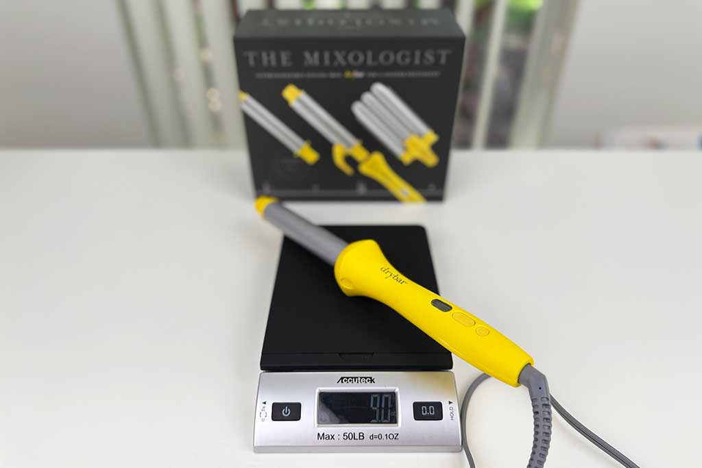 Scale reading 9 ounces with the Drybar Mixologist wand on top.