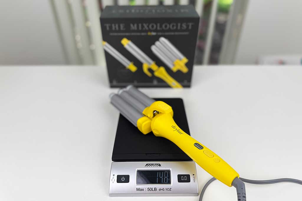 Digital scale displaying 14.8 ounces for the Drybar Mixologist triple waver.