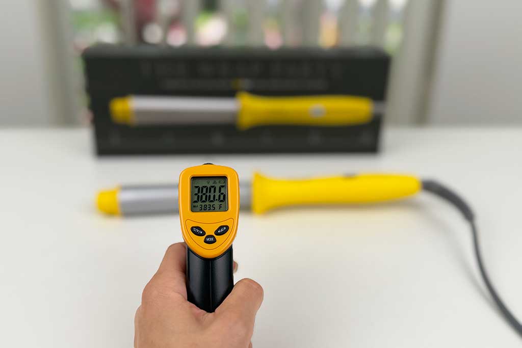 Infrared thermometer reading 380°F on the barrel surface.
