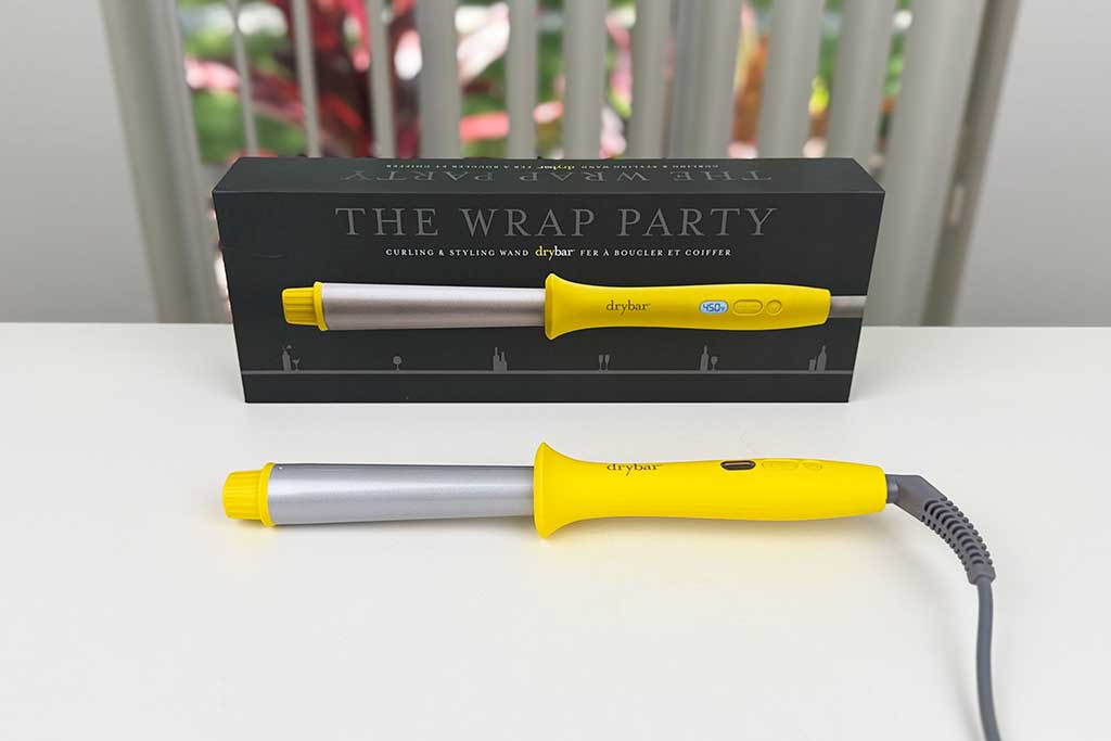 Drybar Wrap Party Curling Wand photographed at BeautiLAB Studio, showing its reverse-tapered ceramic barrel and LED display.