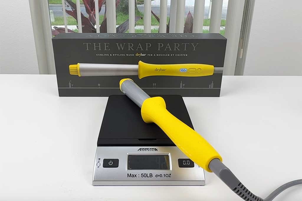 Digital scale reading ~8 oz with the wand on top.