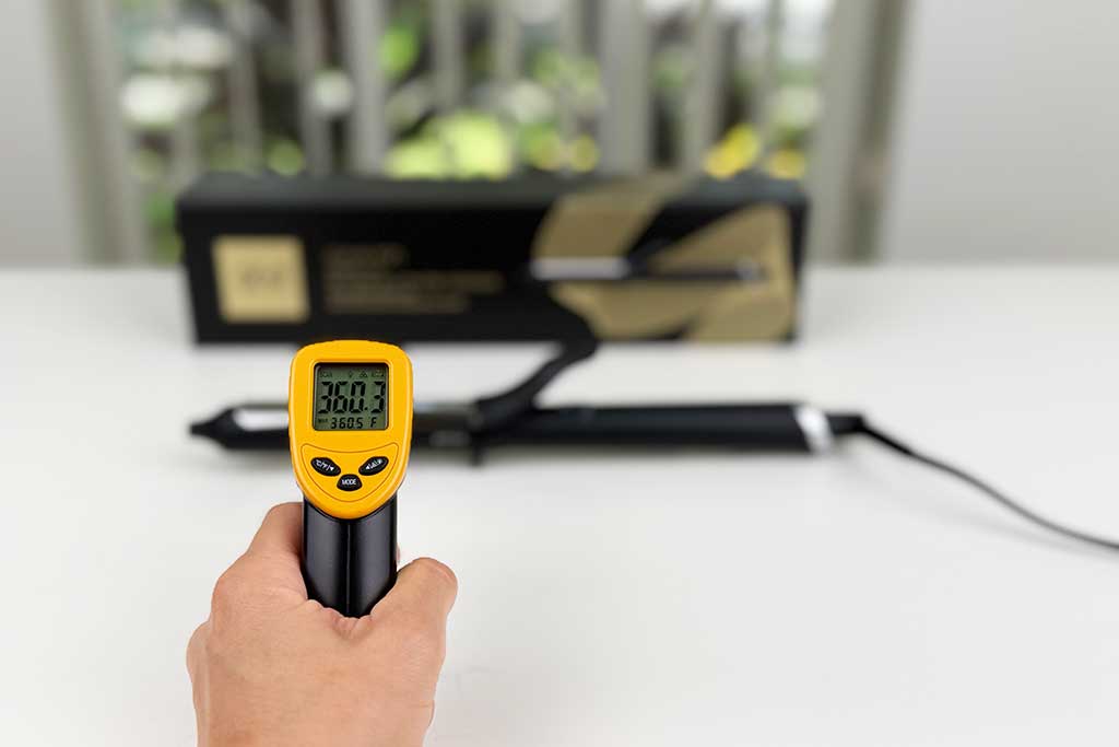 Infrared thermometer showing 360°F on the barrel of the GHD Classic Curl Curling Iron.