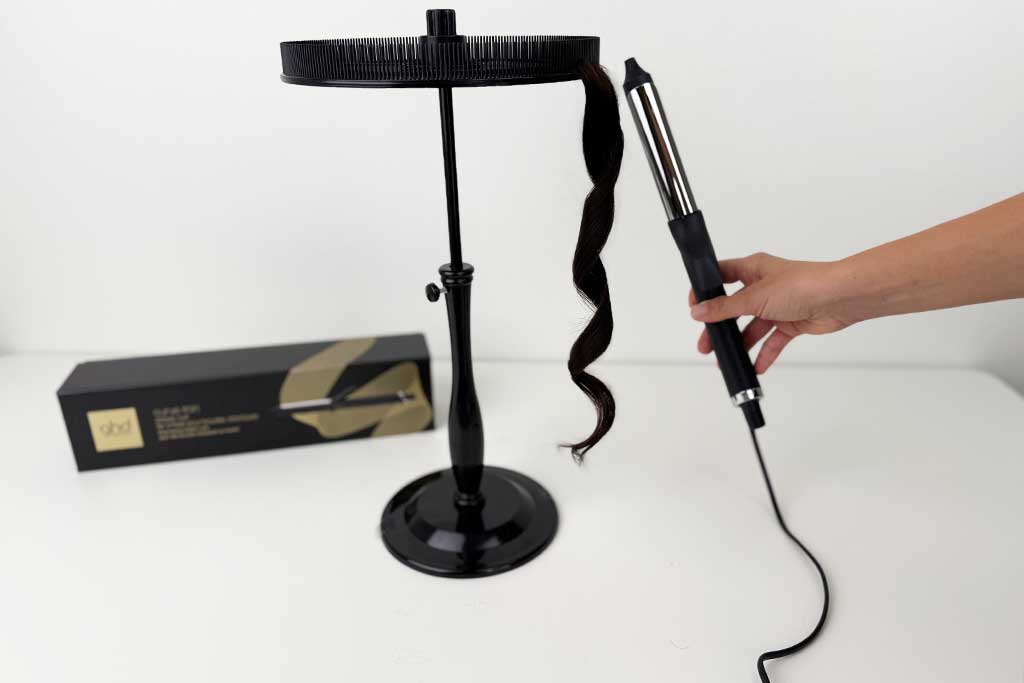 Close-up of polished curls created on wig hair using the GHD Classic Curl Curling Iron.