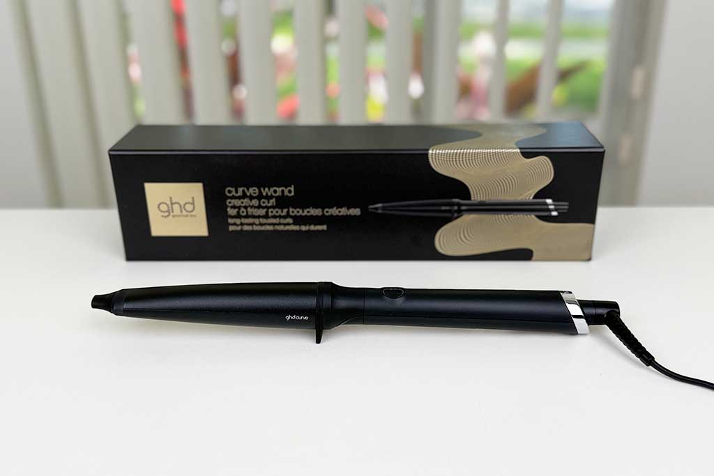 GHD Creative Curl Wand photographed at BeautiLAB Studio, highlighting its tapered ceramic barrel and sleek black design.