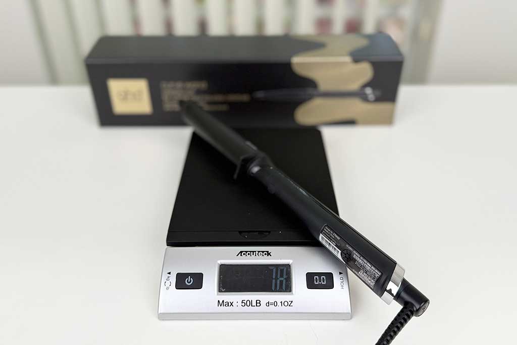Digital scale displaying 7.8 ounces with the GHD Creative Curl Wand placed on top.