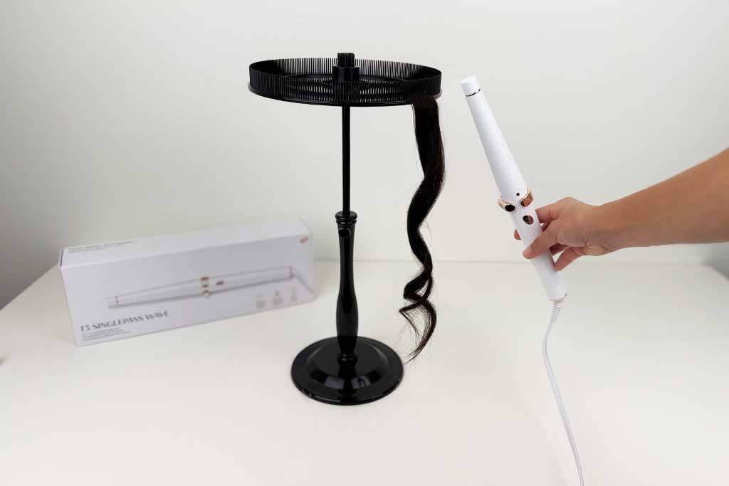 Close-up of curls created on wig hair using the T3 SinglePass Wave curling wand, showing smooth, defined waves.