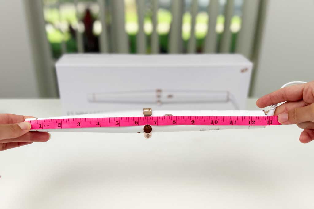 Measuring tape showing the full 12.8-inch length of the T3 SinglePass Wave curling wand on a white background.