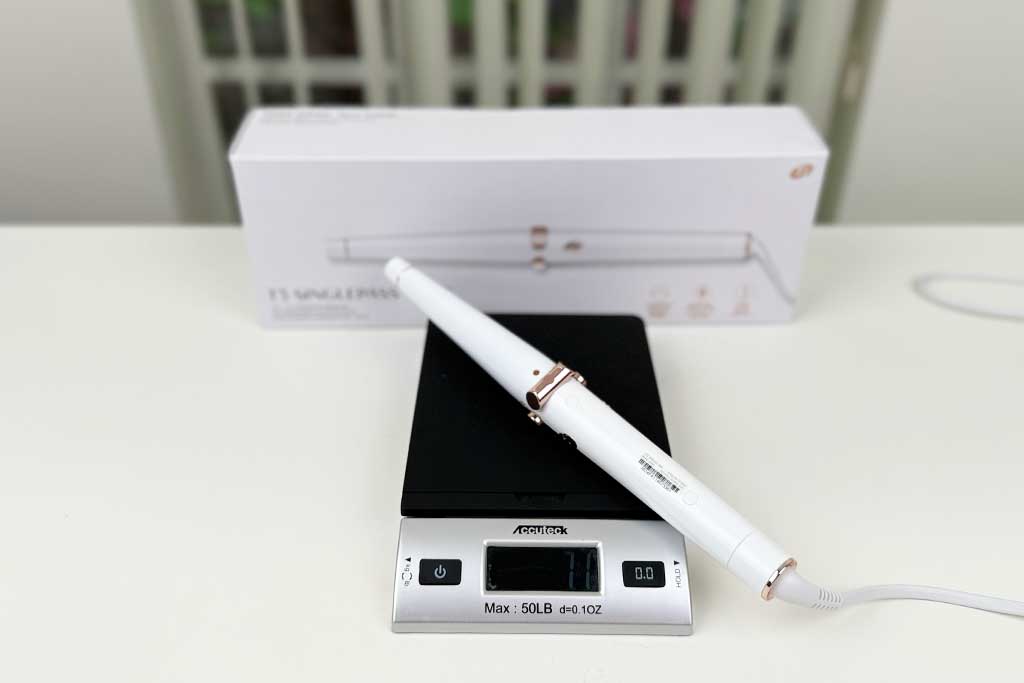 Digital scale displaying 7.1 ounces with the T3 SinglePass Wave curling wand placed on top.