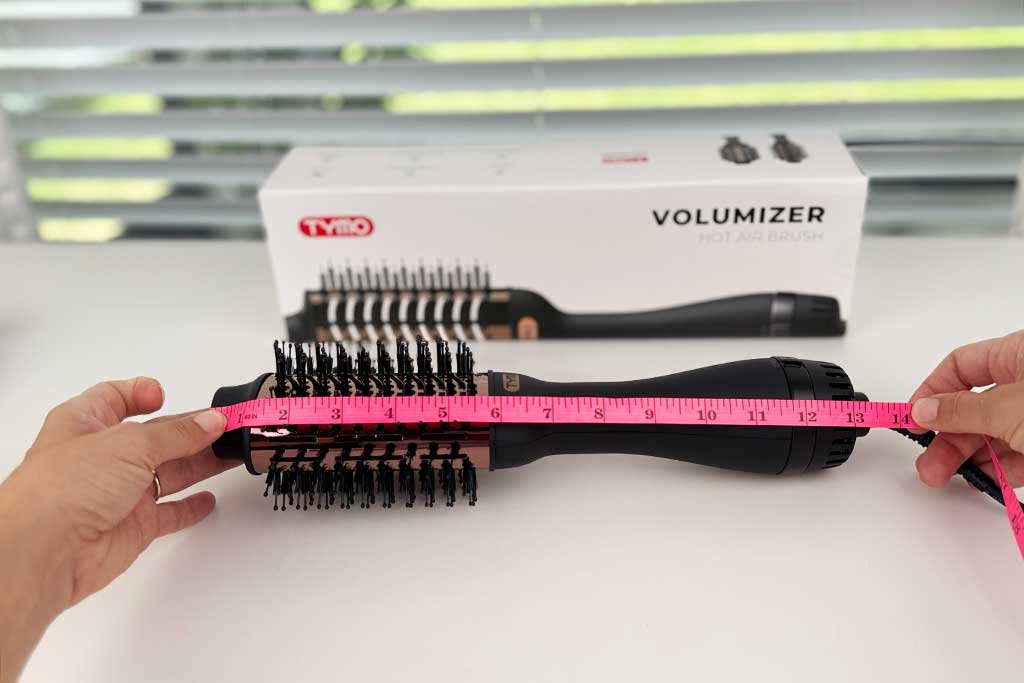 Measuring tape alongside TYMO VOLUMIZER showing total tool length of 13 inches