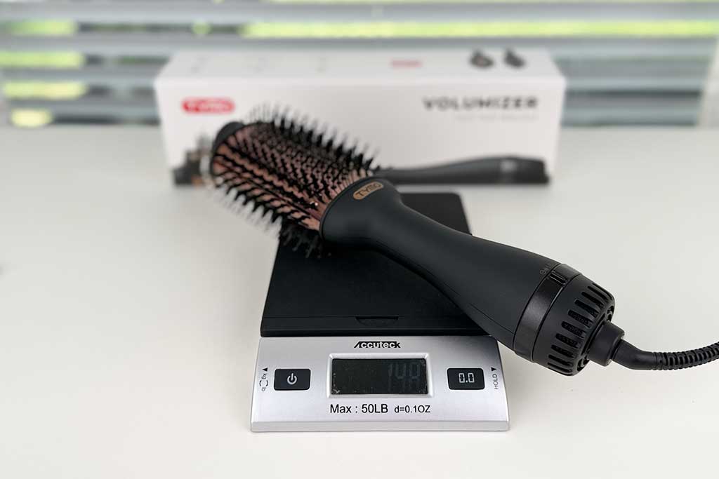 TYMO weight recorded at 14.8 oz on a digital scale