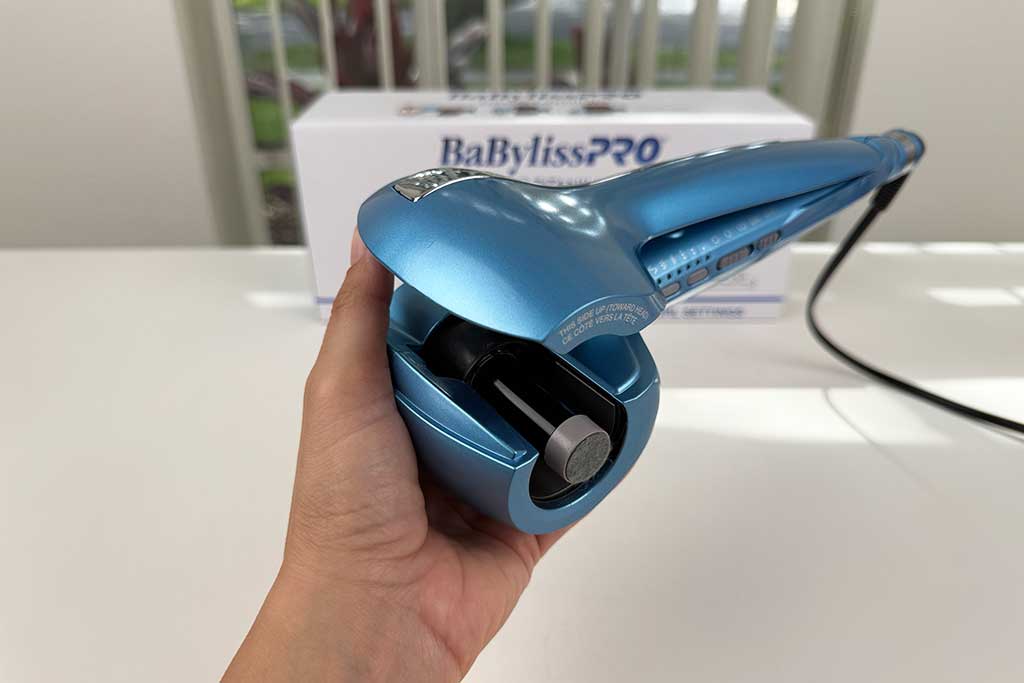 Detailed close-up of the BaBylissPRO MiraCurl 3’s curl chamber design with titanium–ceramic finish.