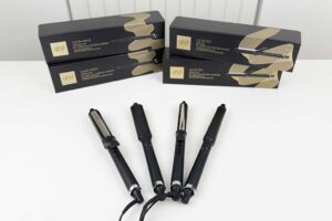 GHD Curling Irons lineup photographed at BeautiLAB Studio, including the Classic Curl Iron, Creative Curl Wand, and Classic Wave Wand, displayed side by side.