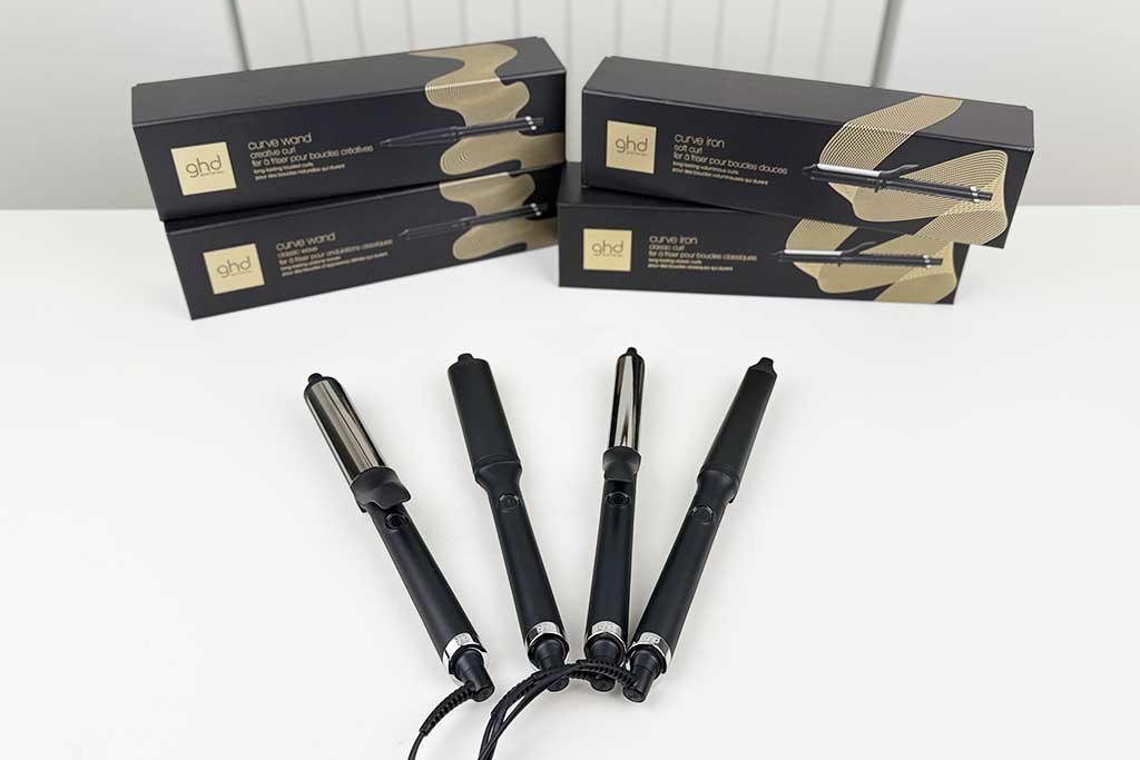 GHD-Curling-Irons-Review-featured GHD Curling Irons lineup photographed at BeautiLAB Studio, including the Classic Curl Iron, Creative Curl Wand, and Classic Wave Wand, displayed side by side.