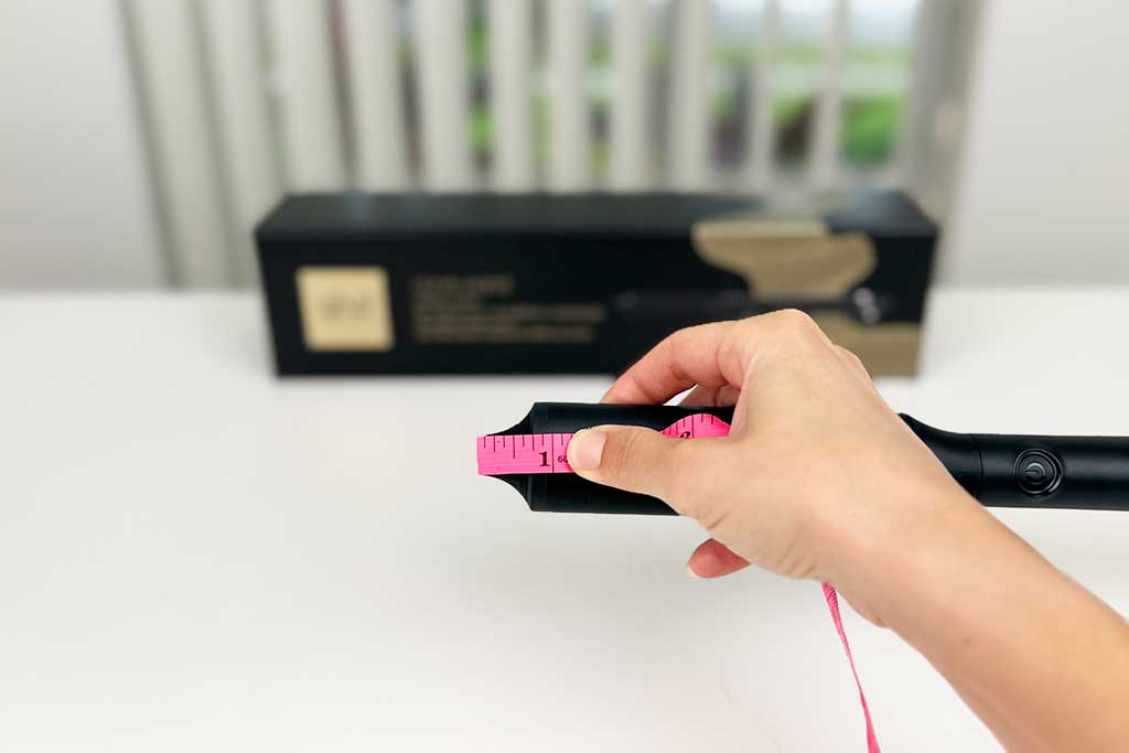 Caliper measuring the 0.75-inch cool tip length of the GHD Classic Wave Wand.