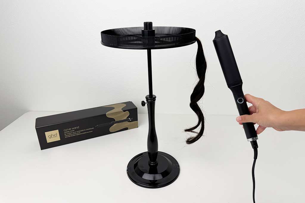 Close-up of human hair styled with the GHD Classic Wave Wand, showing smooth, glamorous S-shaped waves.
