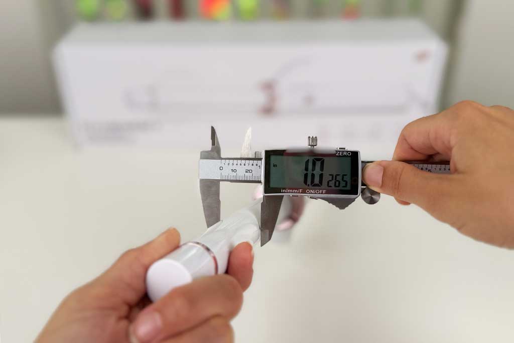 Digital caliper measuring the 1-inch ceramic barrel width of the T3 CurlWrap curling iron.
