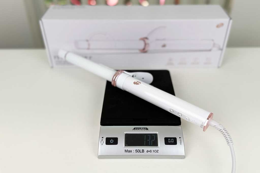 Digital kitchen scale displaying 13.2 ounces with the T3 CurlWrap curling iron placed on top.