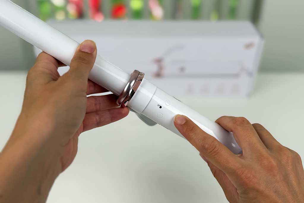 Close-up of the T3 CurlWrap curling iron showing its ion generator feature, the only curling iron with built-in ion technology for smoother, frizz-free results.