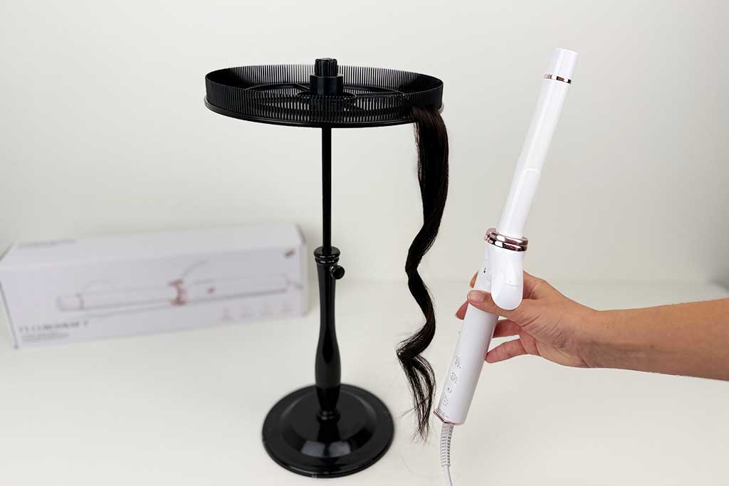 Close-up of smooth, frizz-free curls created on wig hair with the T3 CurlWrap curling iron.