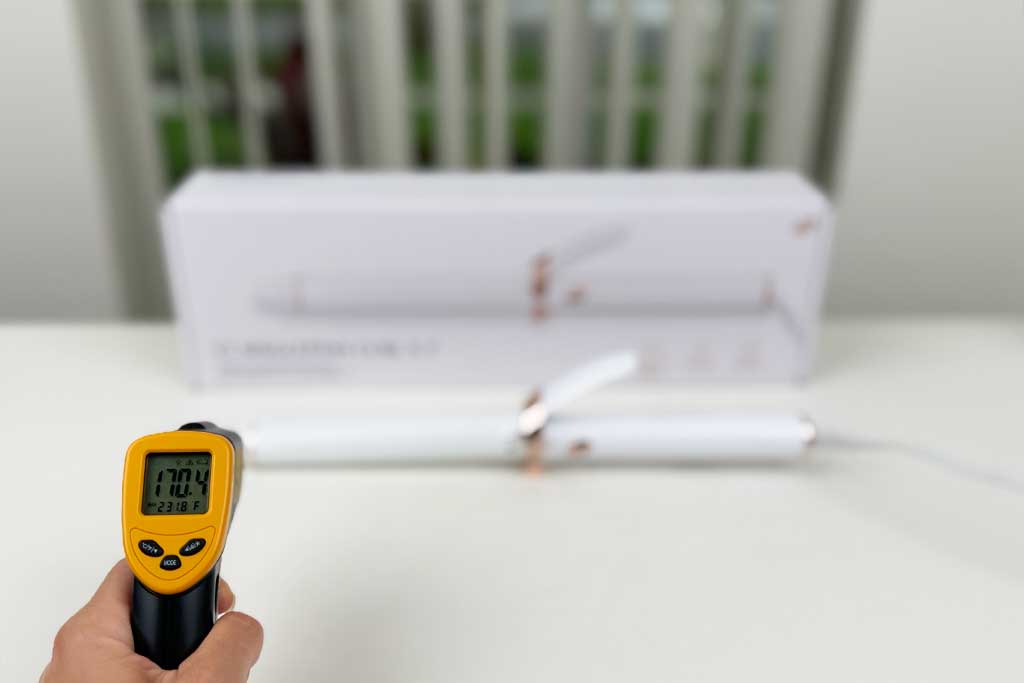 Infrared thermometer showing 170°F while aimed at the cool tip of the T3 SinglePass Curl X curling iron.