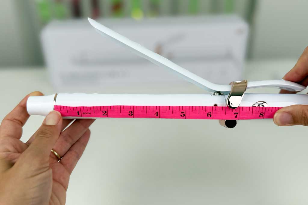 Measuring tape showing the 6.5-inch barrel length of the T3 SinglePass Curl X curling iron.