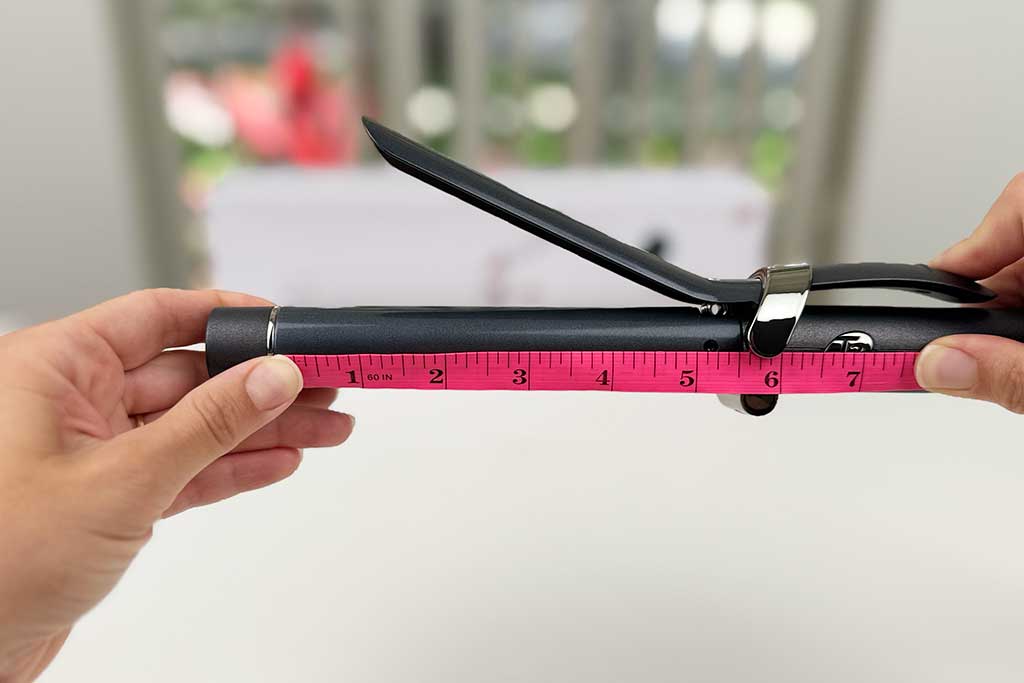 Measuring tape showing the 5-inch barrel length of the T3 SinglePass Curl curling iron.